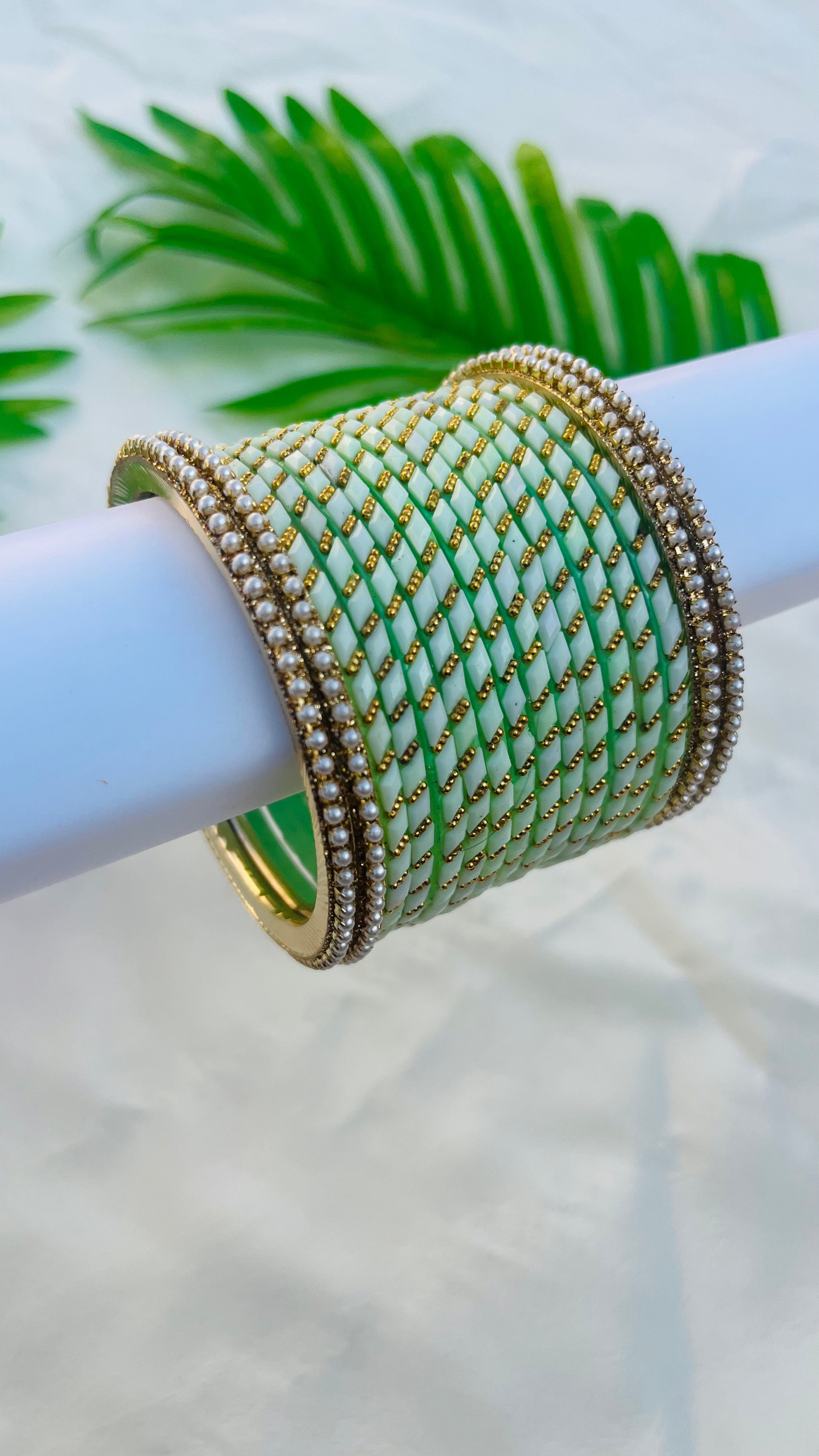 ANIKSHYA PISTA GREEN GLASS BANGLE AND WHITE PEARL METAL BANGLE VH050