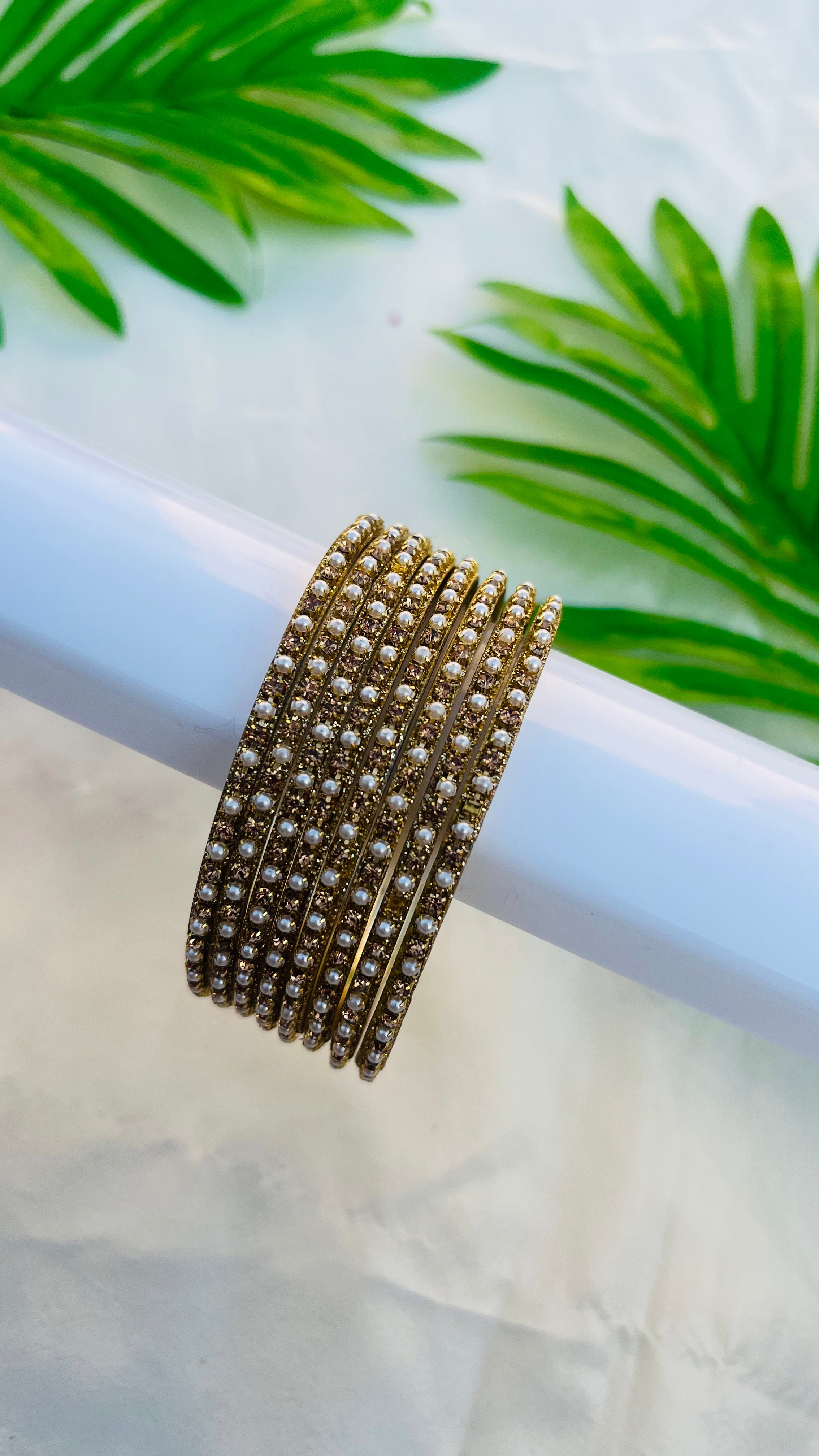 ANIKSHYA GOLD STONE AND WHITE PEARL METAL BANGLE VH059