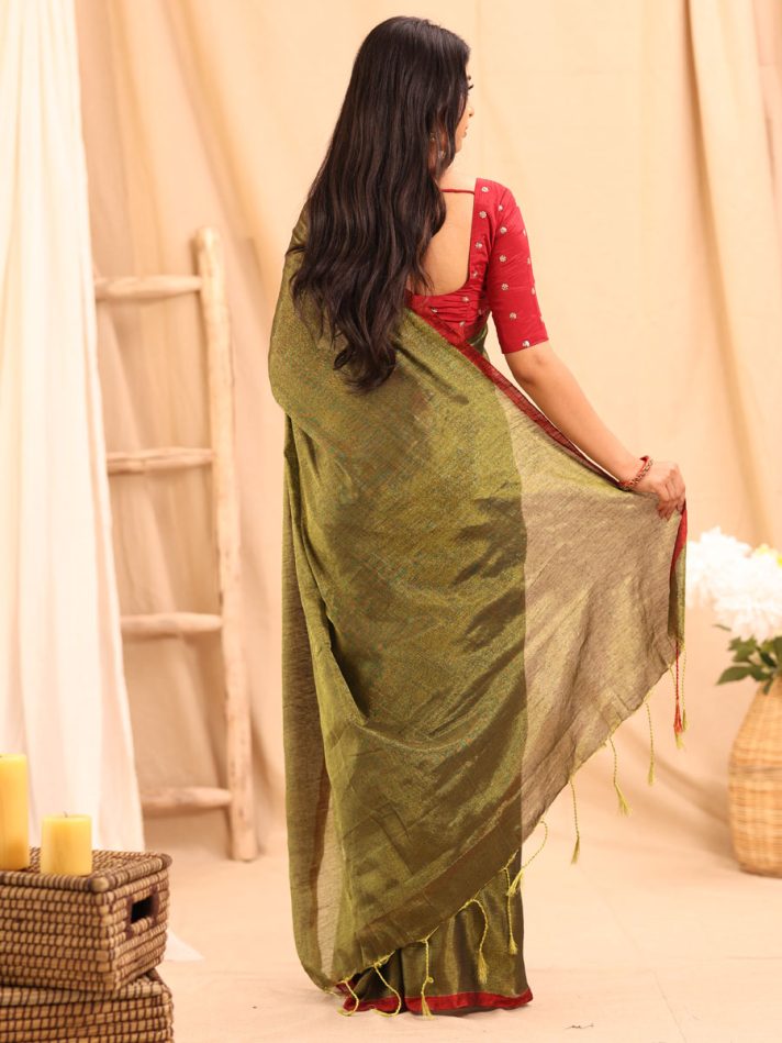 Anikshya Mehendi Gold Tissue silk saree with Red Border