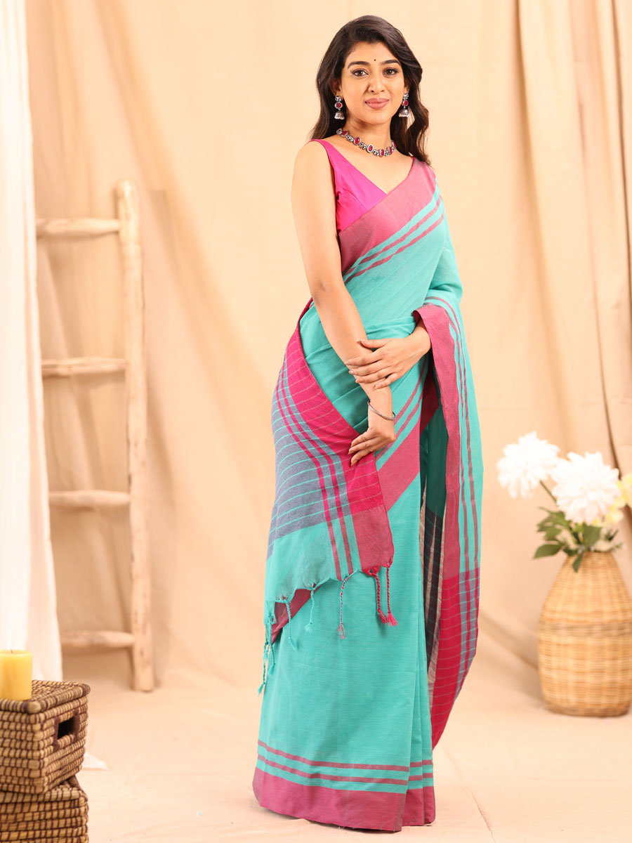 Anikshya Mul Turquoise with Pink Border saree