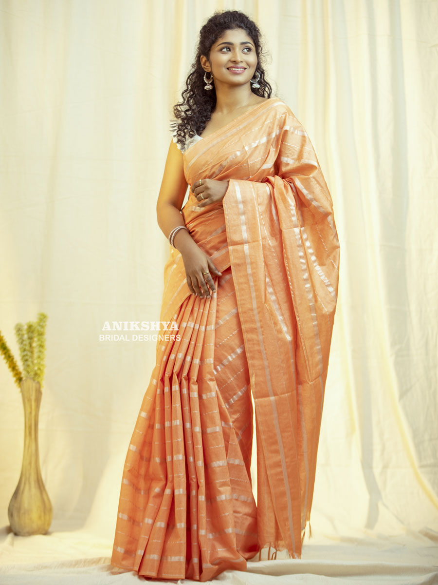 Anikshya Peach Kota Viscose Silk saree with silver stripes