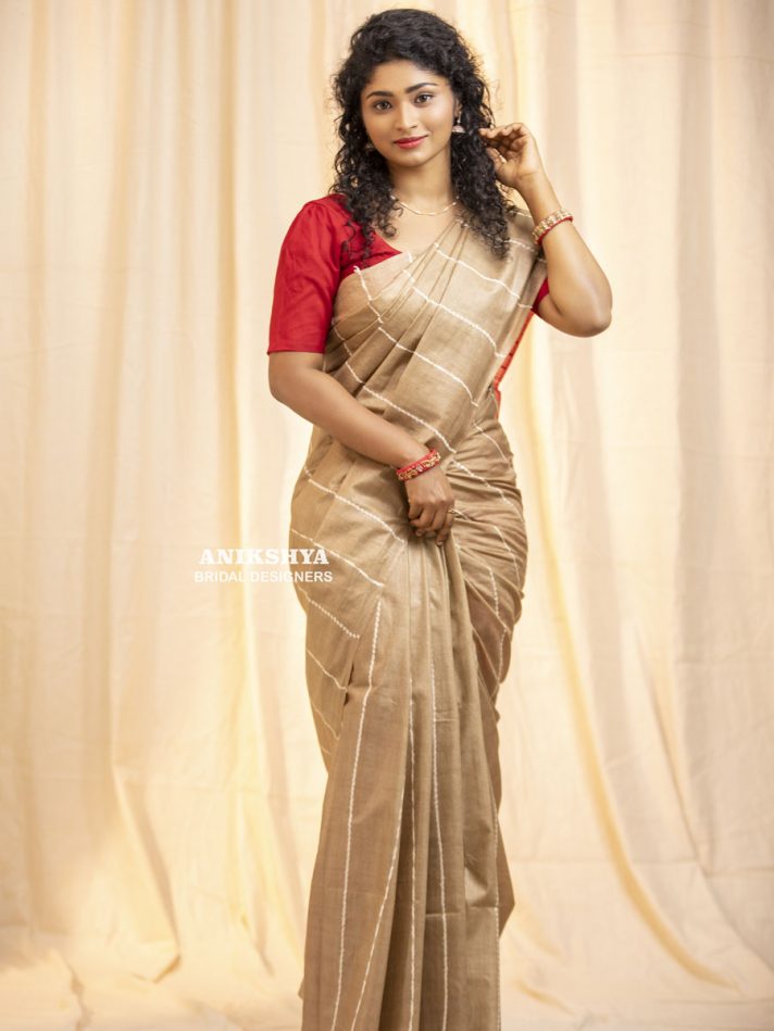 Anikshya Beige Kota Viscose Silk saree with Running Stitch embroidery