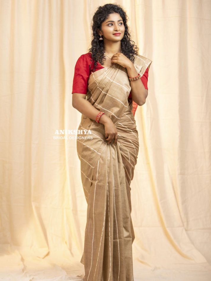 Anikshya Beige Kota Viscose Silk saree with Running Stitch embroidery