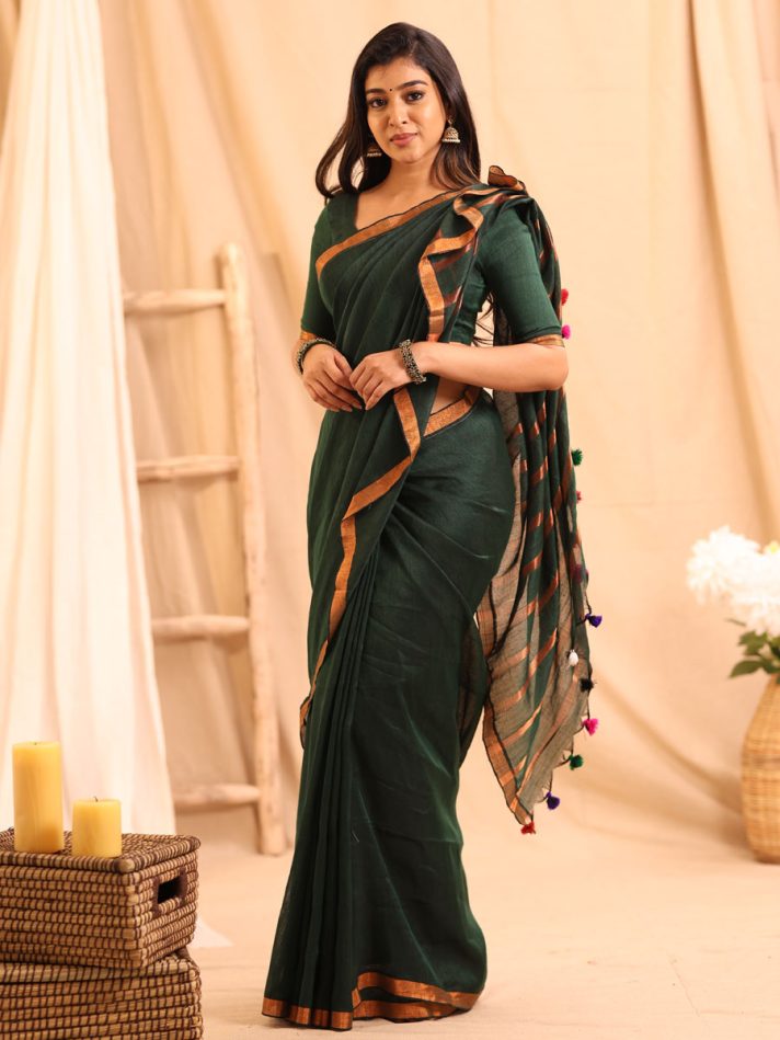 Anikshya Bottle Green Linen saree with Copper Gold Border