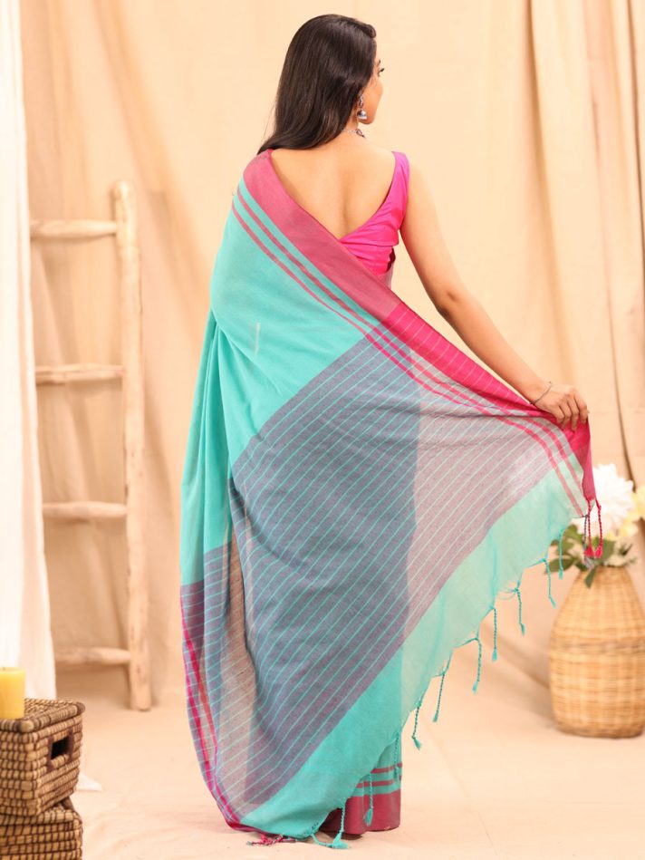 Anikshya Mul Turquoise with Pink Border saree