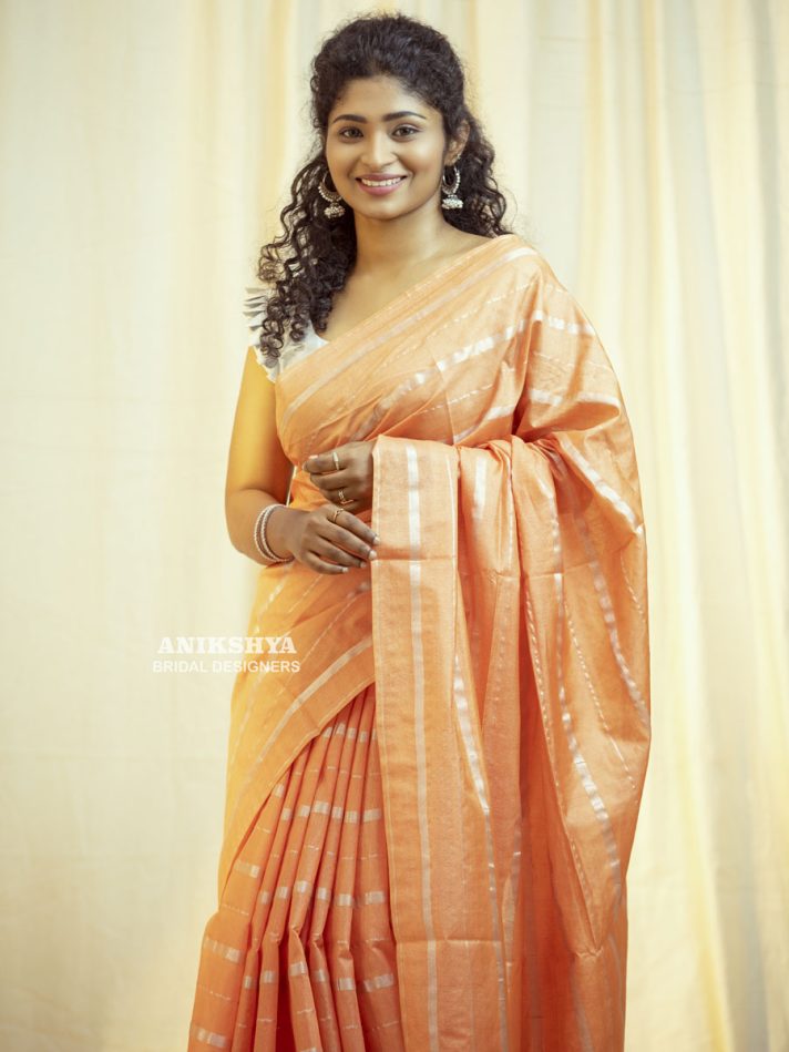 Anikshya Peach Kota Viscose Silk saree with silver stripes