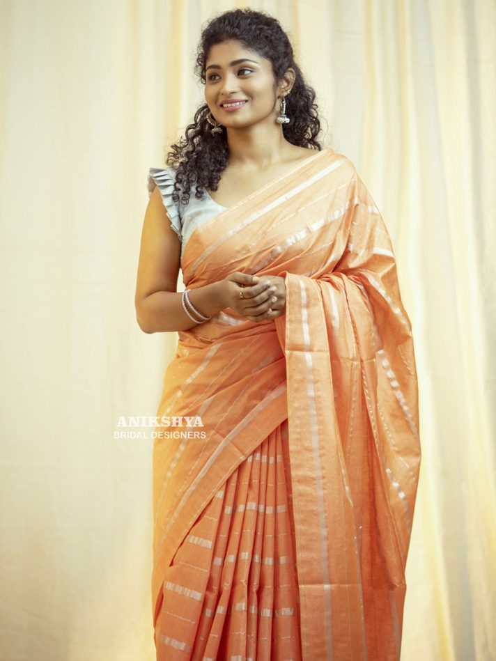 Anikshya Peach Kota Viscose Silk saree with silver stripes